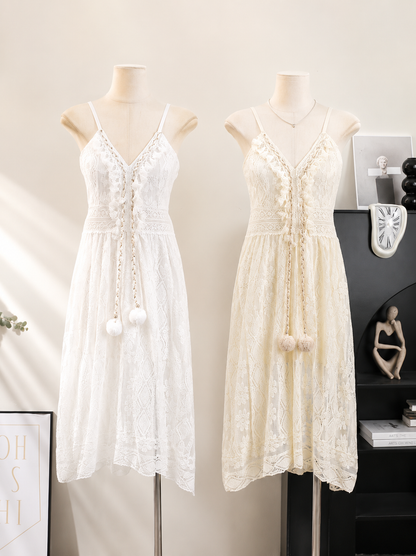 Two white lace dresses on mannequins against a neutral background